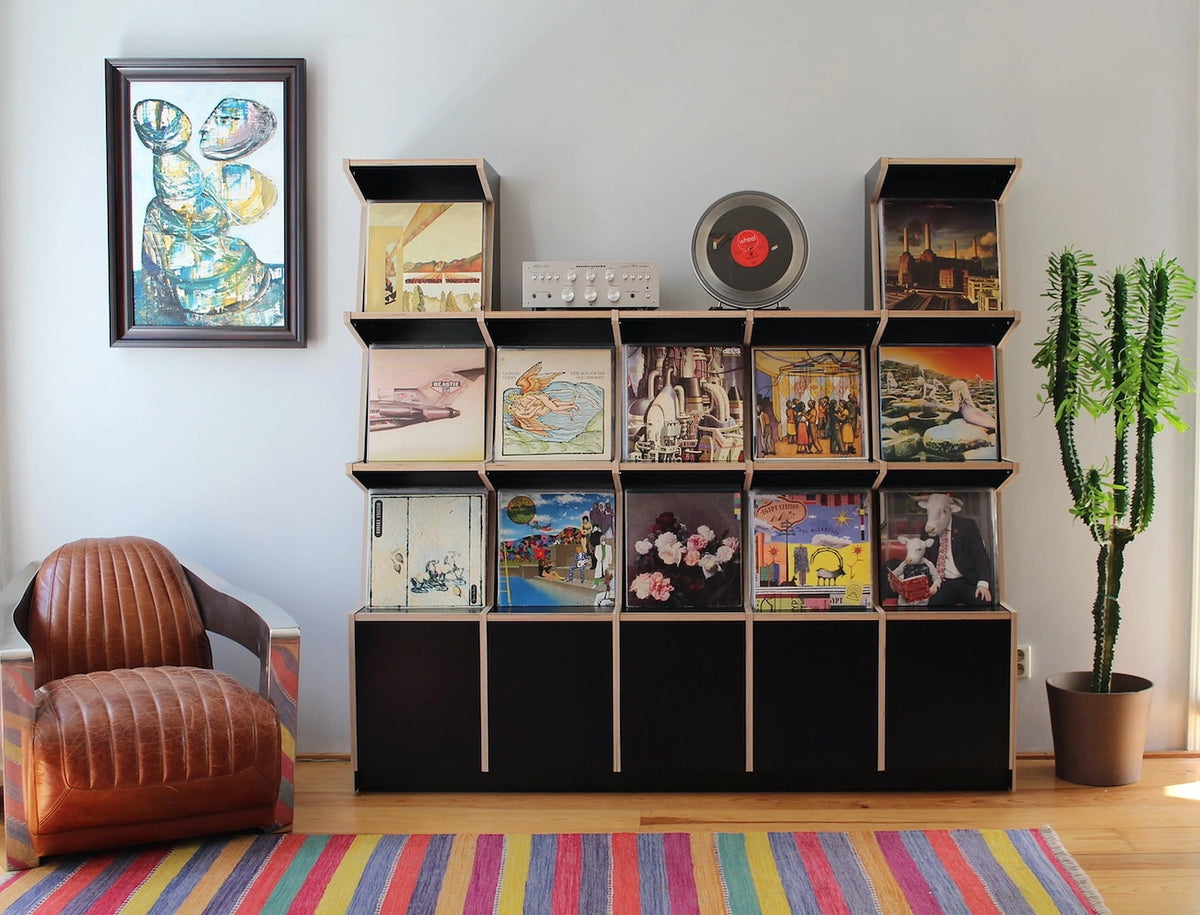 Coverfront in black birch plywood, with a taller column at each end, amplifier and turntable on top