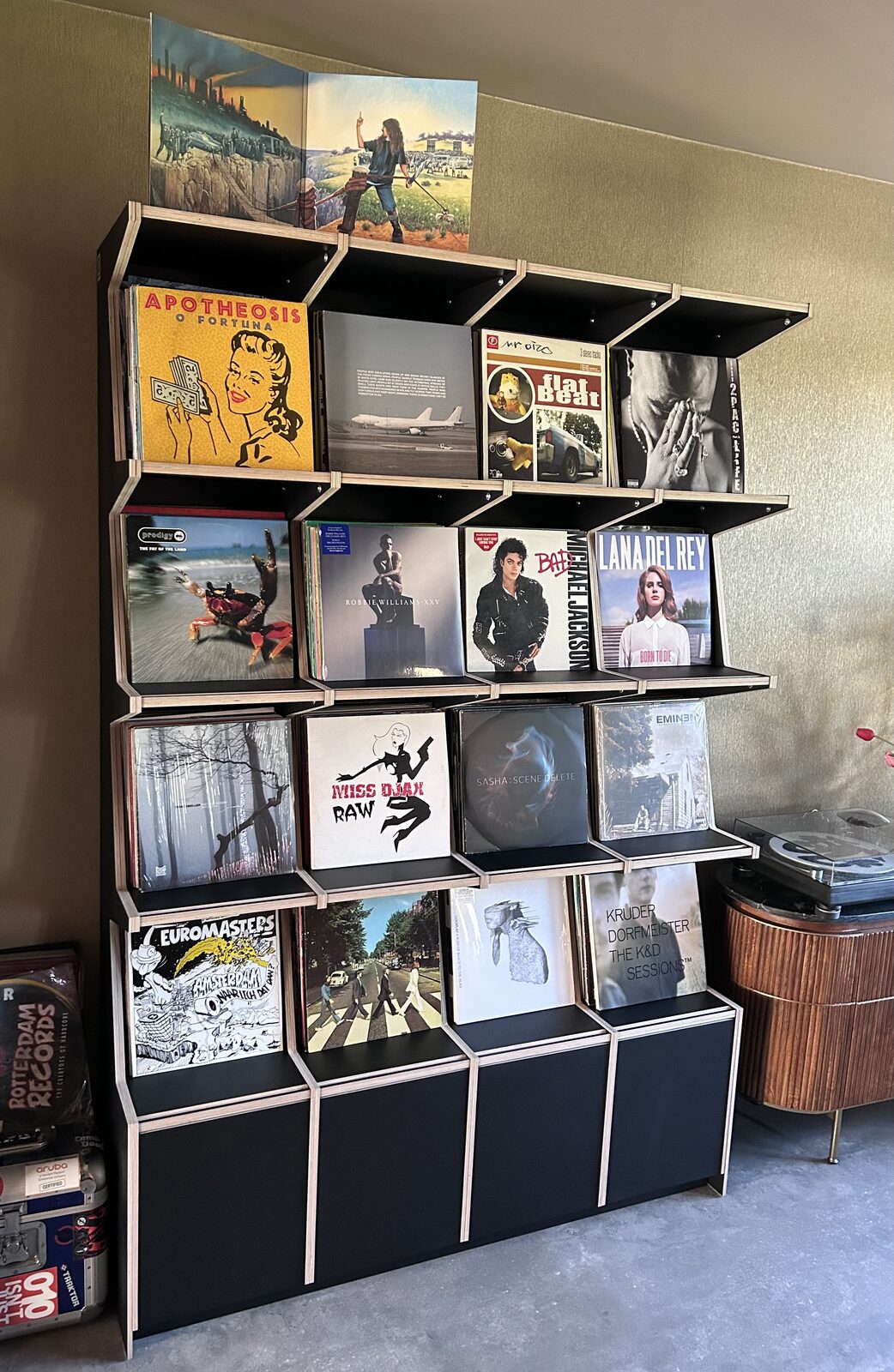 Ophon Coverfront record cabinet in birch plywood, black, four columns, four compartments high, with records standing cover-forward