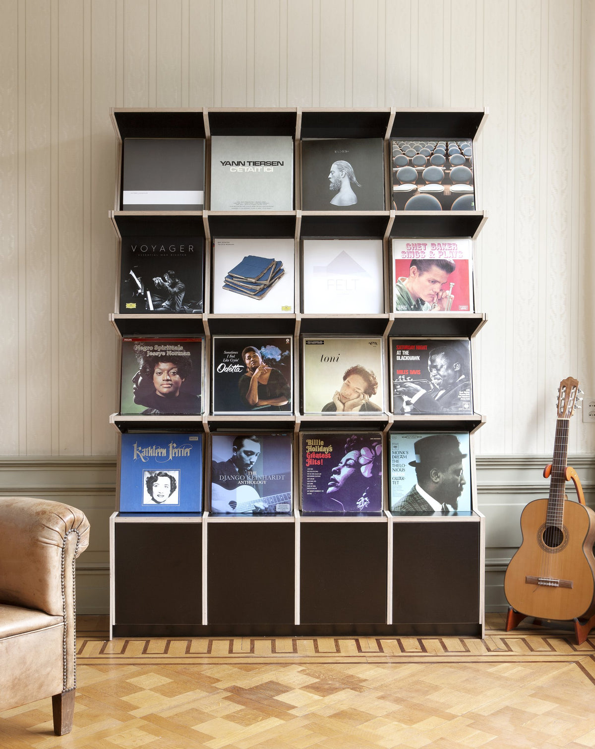 Coverfront record cabinet in black birch plywood, four wide and four high, in a classic living room