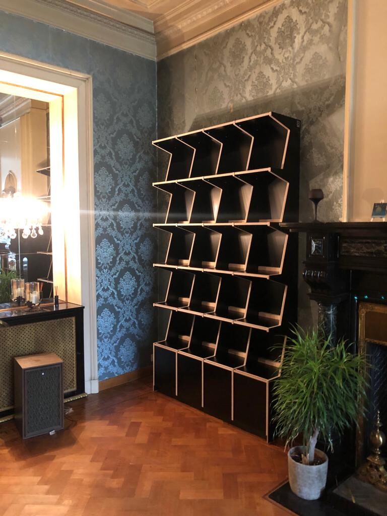 Ophon Coverfront record cabinet in birch plywood, black, four columns, five compartments high, with records standing cover-forward