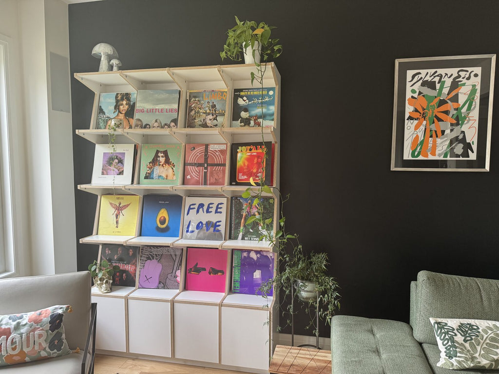 Ophon Coverfront record cabinet in birch plywood, white, four columns, four compartments high, with records standing cover-forward