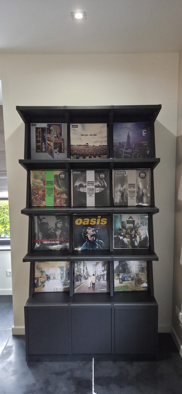 Ophon Coverfront record cabinet in sprayed MDF, RAL 7021, three columns, four compartments high, with records standing cover-forward
